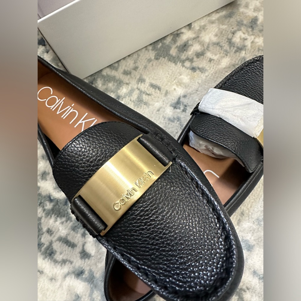BRAND NEW Calvin Klein Women Loafers. Black color. Size 9.5